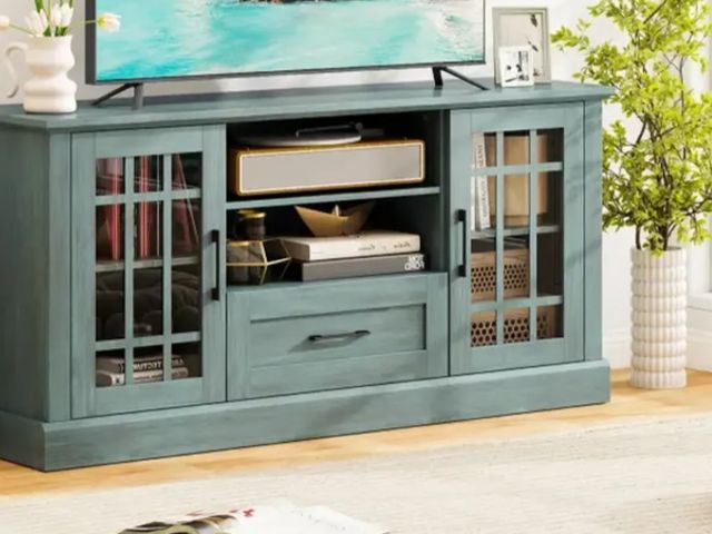 Lot 96-197588 - TV Stand for TVs up to 70 with Glass Doors Cubbies and Drawer Green New MSRP $185