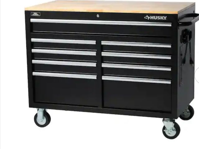 Lot 96-170740 - Husky 46 in. long Standard Duty 9-Drawer Mobile Workbench Tool Chest with Solid Wood Top in Gloss Bl...