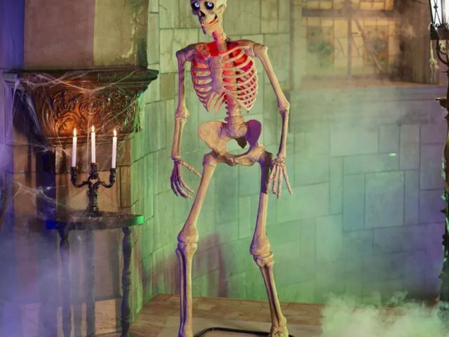 Lot 96-183188 - Home Accents Holiday 6.5 ft. Grave &amp; Bones Animated LED App Controlled Ultra Skelly with LifeEye...