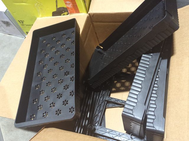 Lot 96-170325 - Appears to be some sort of organizer, possibly for plants with drainage holes, appears unused