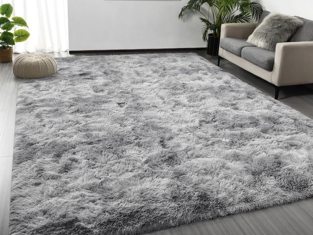 Lot 96-207666 - Grey shag area rug, dimensions unknown appears lightly used