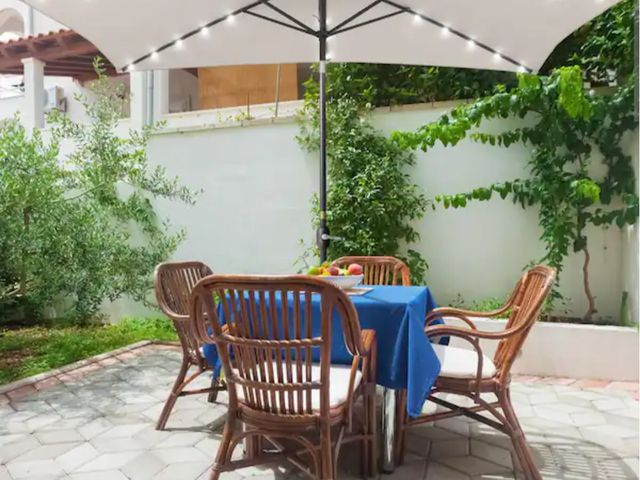 Lot 96-166581 - Sonkuki Solar LED 10 ft. x 6.5 ft. Steel Patio Rectangle Market Umbrella in Beige with Push-Button T...