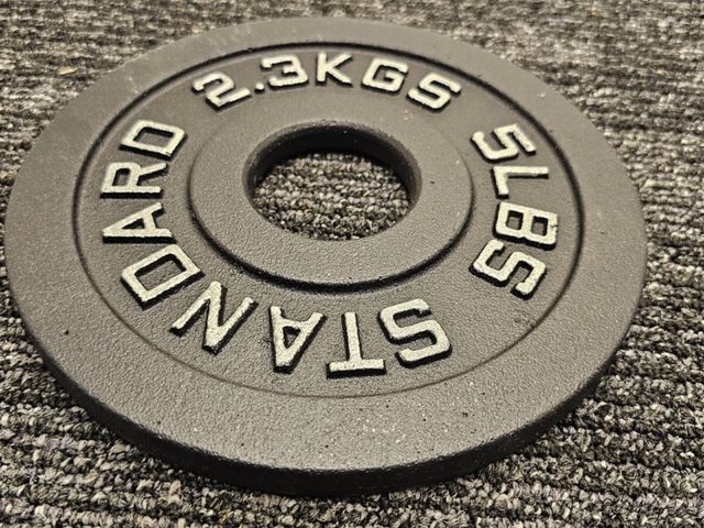 Lot 96-176846 - (QTY 2) Standard Weight Plates Center-Hole 2.3kgs 5lbs Black Gym Strength Train
New