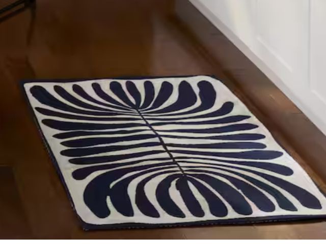 Lot 96-173795 - TOWN &amp; COUNTRY LIVING
Luxe Livie Matisse Cutout Navy Blue 24 in. x 40 in. Machine Washable Kitch...