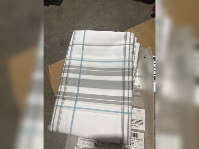 Lot 96-233160 - Appears to be a table cloth. News size unknown