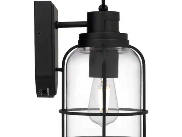 Lot 96-211296 - Quoizel Camberly 12.13 in. Matte Black Motion Sensing Dusk to Dawn Outdoor Hardwired Wall Lantern Sc...