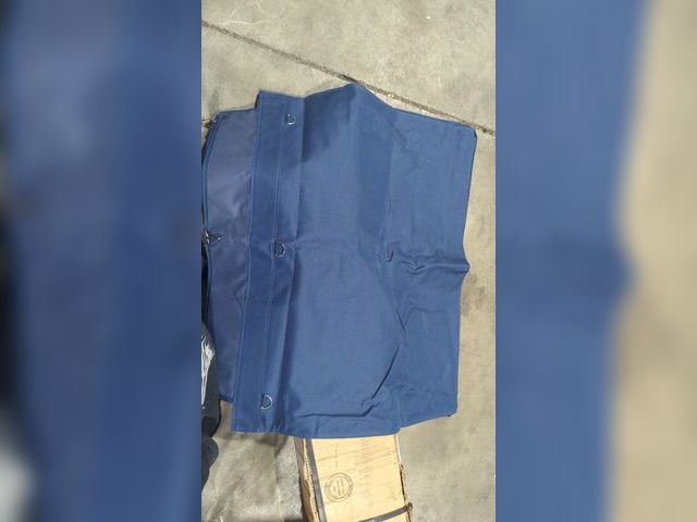 Lot 96-177424 - Blue Cover tarp with attachments, exact purpose unknown, new, approximately 31 in by 24 in
