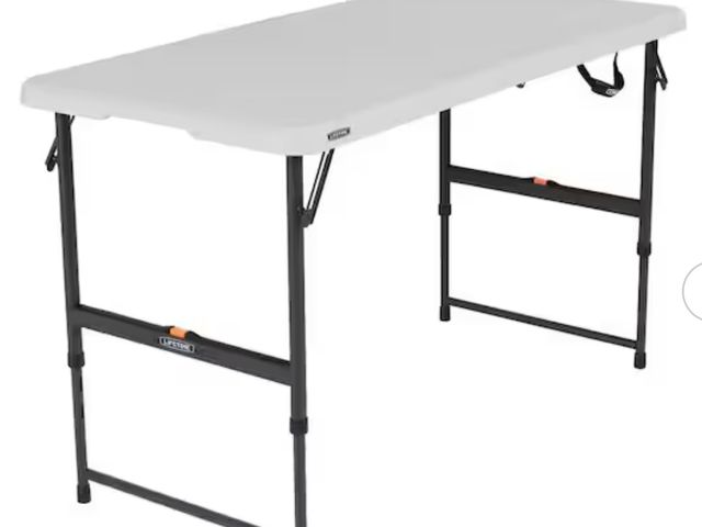 Lot 96-179512 - Lifetime
4 ft. One Hand Adjustable Height Fold-in-Half Resin Table; Almond
Unused. Small dent on top