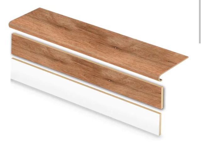 Lot 96-199680 - 2-Pack Cap A Tread Trail Oak 47 in. L x 12.15 in. W x 42.92 mm T Vinyl Overlay Stair Tread and Rever...
