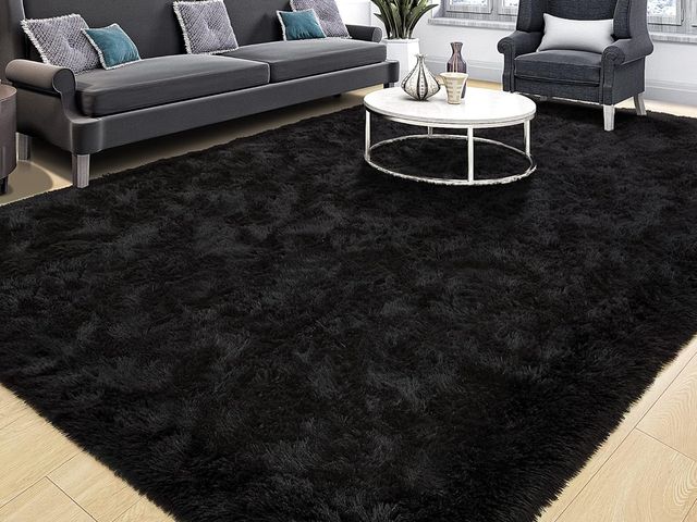 Lot 96-170395 - Large Black Shag Area Rug, dimensions unknown, unused