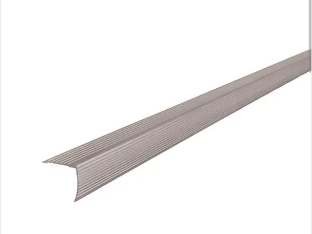 Lot 96-227776 - M-D Building Products 1-1/8"X1-1/8"X 36" PEWTER ALUMINUM STAIR EDGING W/SCREW NAILS unused, one edge...