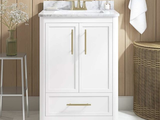 Lot 96-198914 - Home Decorators
Collection
Tamsin 24 in. Single Sink White Bath Vanity with White Round Corner Engin...