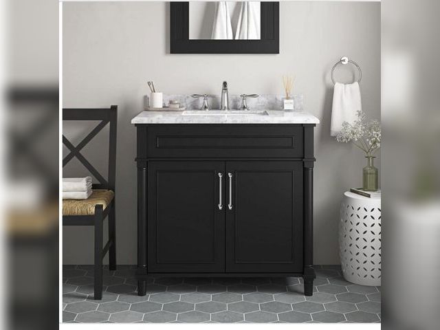 Lot 96-191378 - Home Decorators Collection
Aberdeen 36 in. Single Sink
Black Bath Vanity with Carrara Marble Top (As...