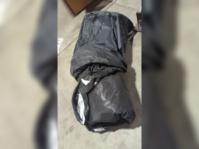 Lot 96-191096 - Appears to be black tarp cover, unknown size for unknown object. Comes with carry bag.