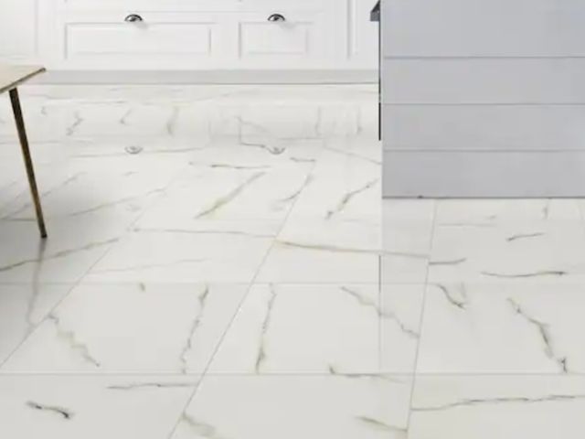 Lot 96-199098 - Approximately 128 ft² MSI White Calacatta Bianco 24 in. x 24 in. Polished Porcelain Marble Look Floo...