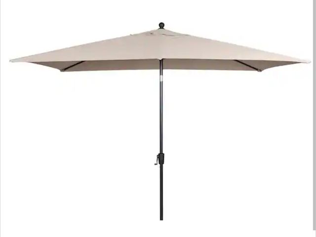 Lot 96-166564 - Hampton Bay 6.5 ft. x 10 ft. Aluminum Market Tilt Patio Umbrella in Riverbed appears Unused