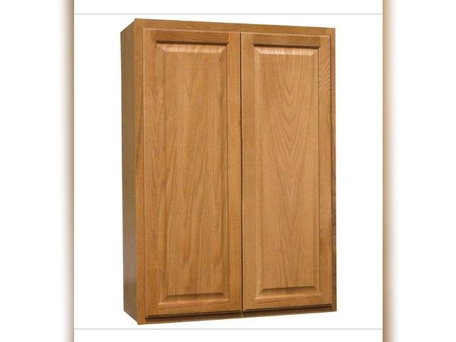 Lot 96-162038 - Hampton Bay Hampton 30 in. W x 12 in. D × 42 in. H Assembled Wall Kitchen Cabinet in Medium Oak MSRP...