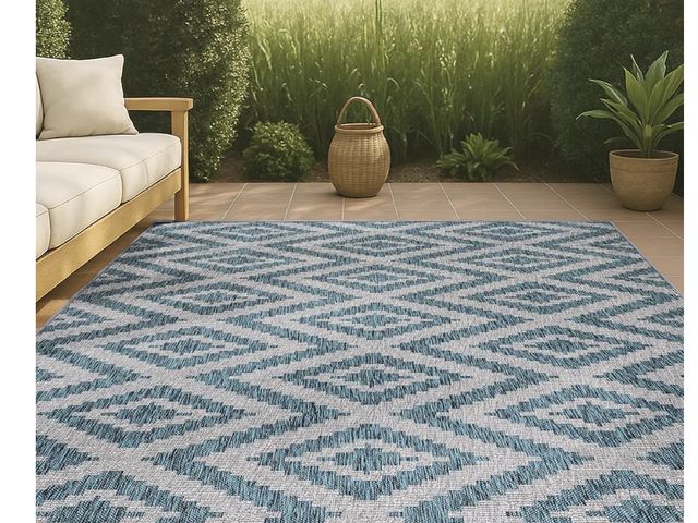 Lot 96-230761 - Teal and white 5 x 8 outdoor rug. May vary from stock photo new.