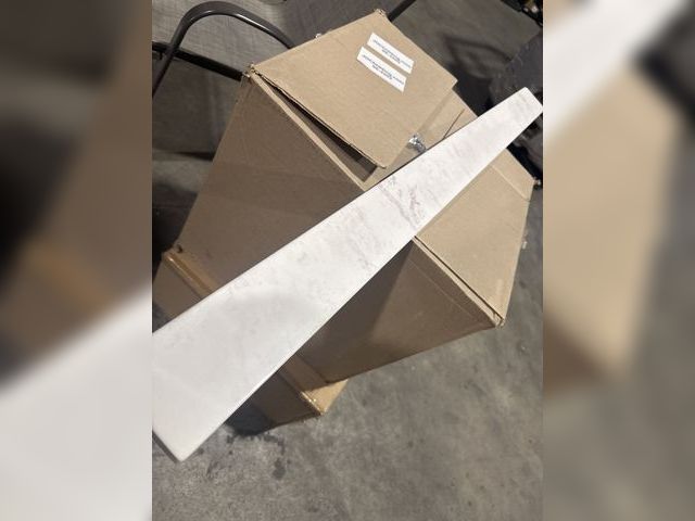 Lot 96-178974 - Appears to Be Large Backsplash Tile 
Approx 48” 
Small Chip On Corner