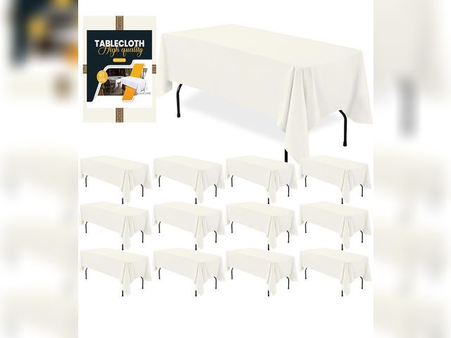 Lot 96-188060 - BIGTONE 12 Pack Ivory Rectangle Tablecloth 60 x 102 Inch, Cross Ribbon Packing Reusable Table Clothe...