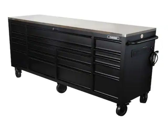 Lot 96-165954 - Husky 84 in. W x 24 in. D 18-Drawer Heavy-Duty Mobile Workbench with Stainless Steel Top in Matte Bl...