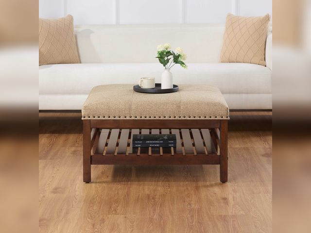 Lot 99-118 - New Designs4Comfort Silverton Tan Fabric Coffee Table Cocktail Ottoman with Storage Shelf The Design...