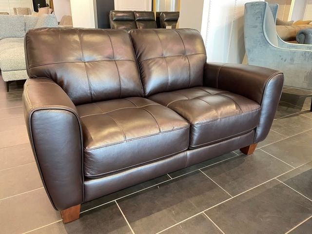 Lot 99-628 - Kaleb 61" Tufted Leather Loveseat Product Detail: Corner blocked hardwood frame constructed with ply...