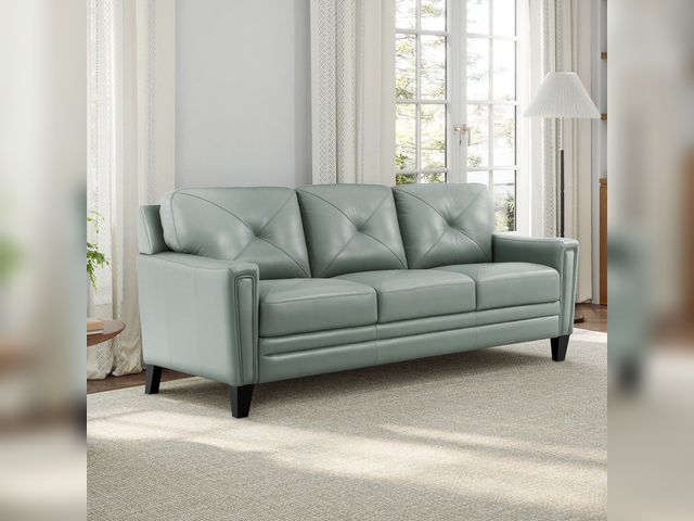 Lot 99-701 - Abbyson Home Atmore Top Grain Leather Sofa – Blue Abbyson Home Atmore three-seat sofa in blue top-gr...